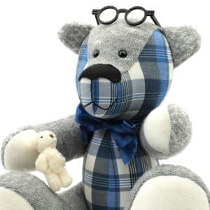 Memory bear wearing glasses on head