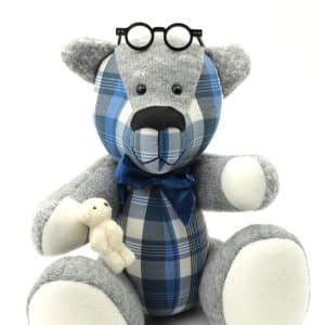 Memory bear wearing glasses on head